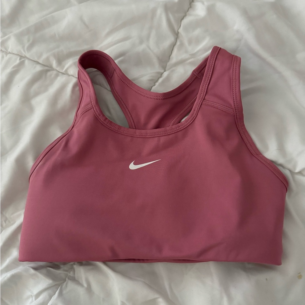 Nike size XS dri fit pink racerback sports bra. Never worn